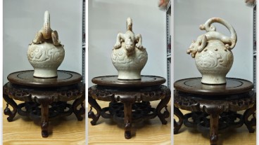 白瓷刻花鼓丁龙首倒流壶